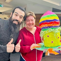 A photo of Mikey with Fiona and her hat