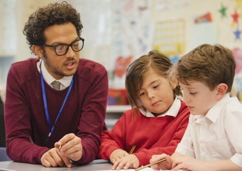 School staff talking to children