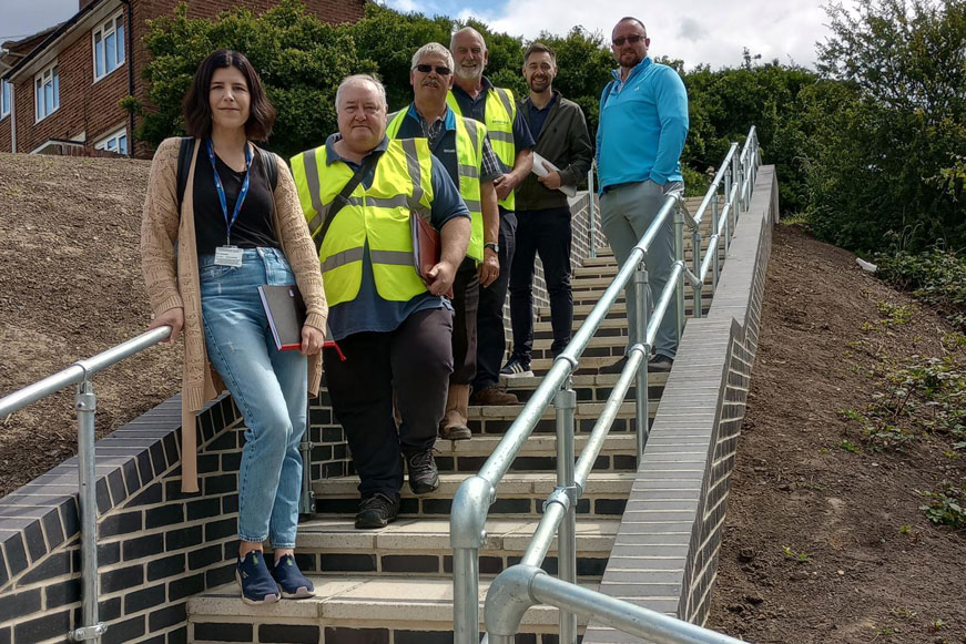 People Standing On New Accesible Footpath In Weston