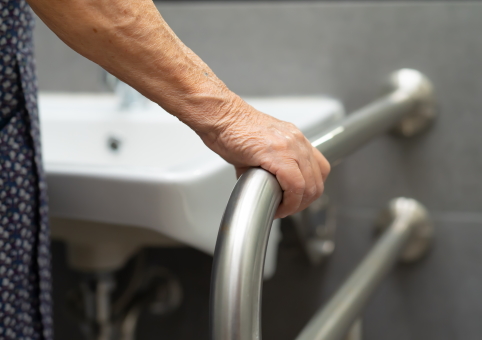 Woman holding bar in bathroom