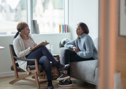 Woman receiving advice from expert