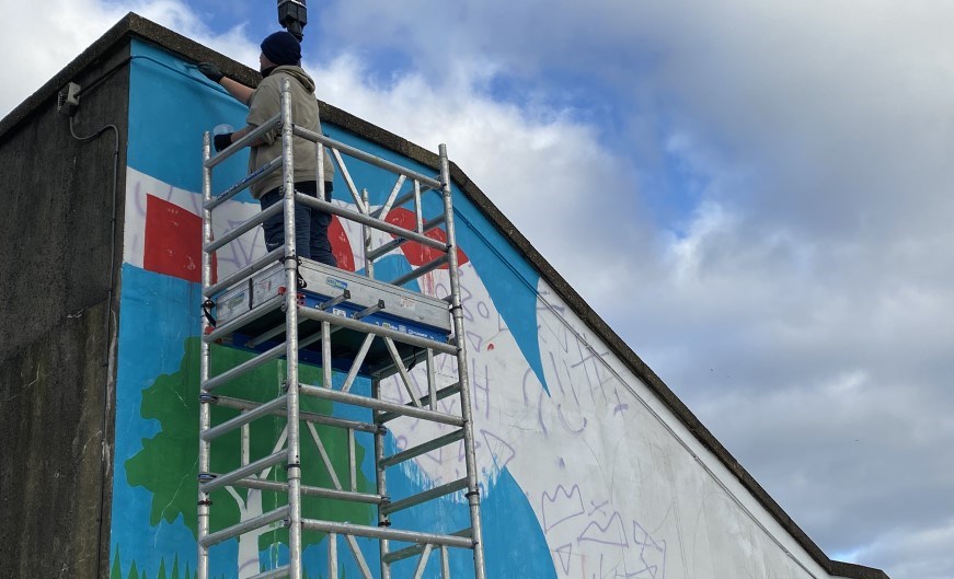 Callum Young starting work on the mural