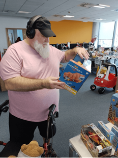 Malcolm choosing a toy to wrap