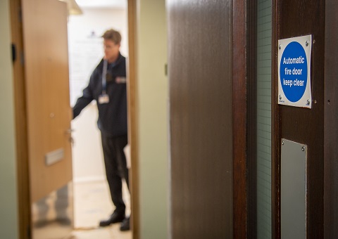 Person walking near a fire door