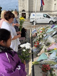 Group photo of service users laying flower at The Civic Centre