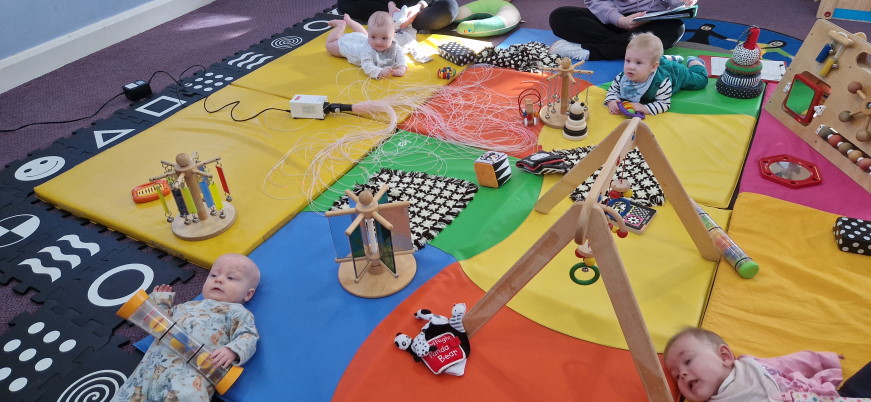 Baby crawling on a play mat