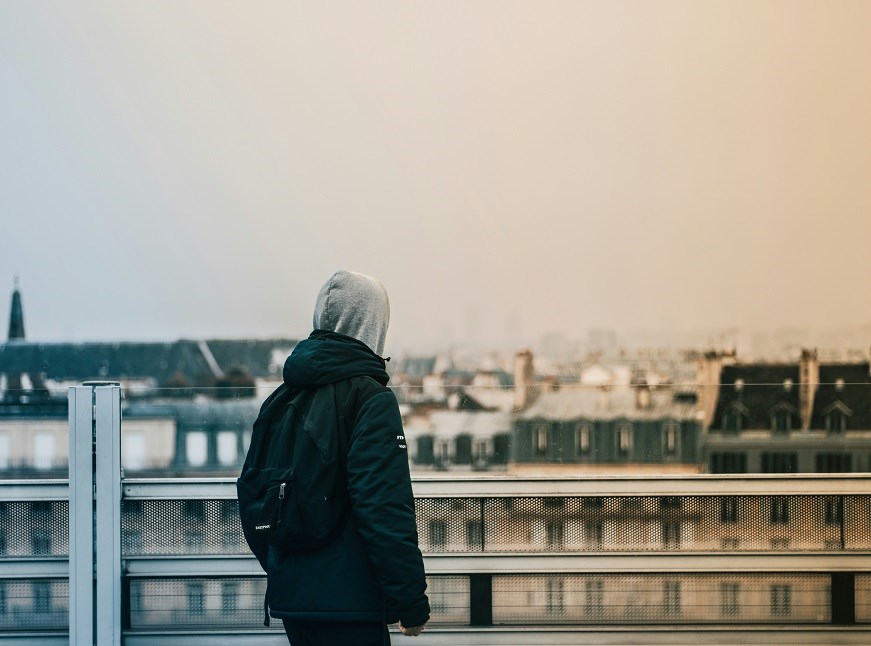 Person standing on top of building