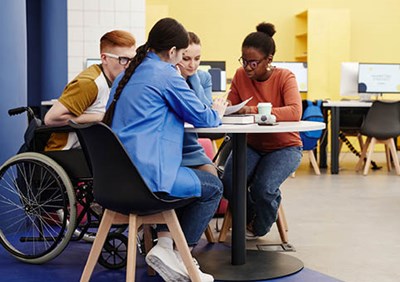 Older pupils gathered around table