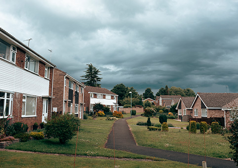 Houses under a darkened sky