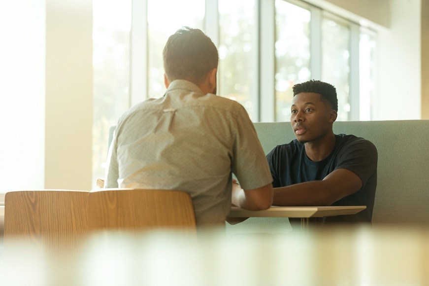 Two men sitting at a table