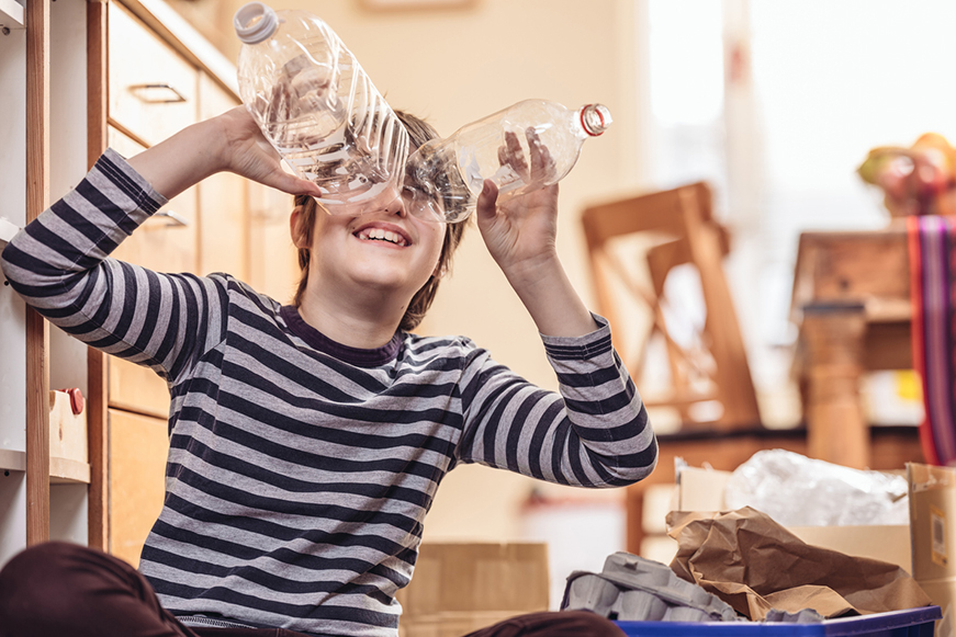 Person Looking Through Two Plastic Bottles