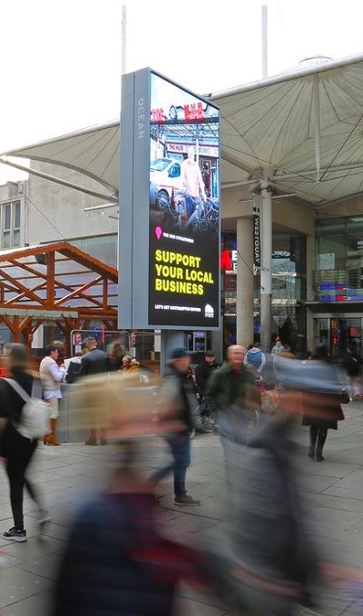 Support your local business sign outside Westquay