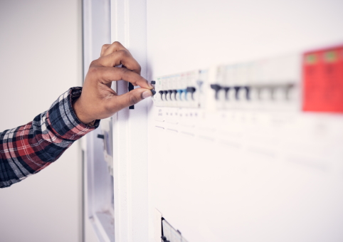 Someone moving a fuse box switch