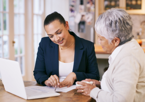 Two people looking at a document together