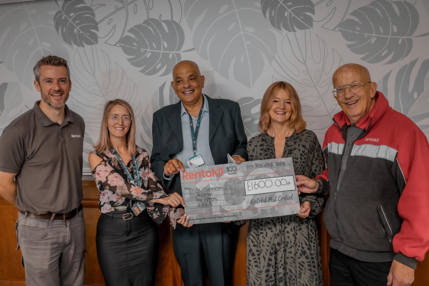 Members of Southampton City Council holding a cheque from Rentokil