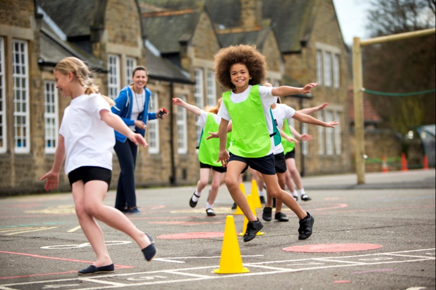 Children and a teacher on a playground