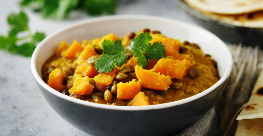 Photo of lentil and sweet potato curry with flatbreads