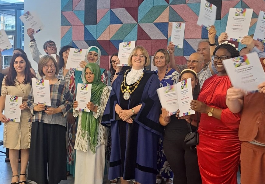 Adult learners posing with the lord mayor