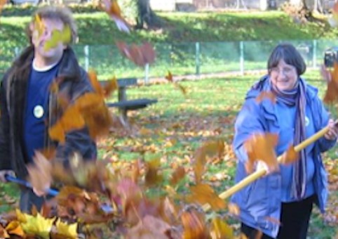 People raking leaves