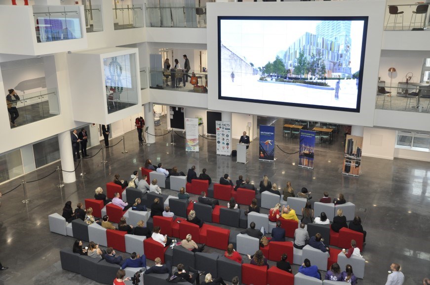 Attendees watching a screen