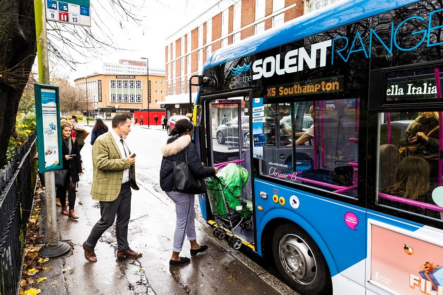 Passengers boarding a bus