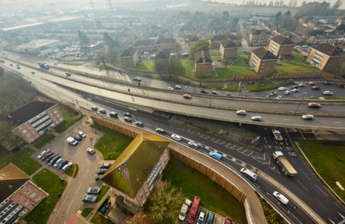 Drone shot image of lots of roads and cars taken on a sunny day