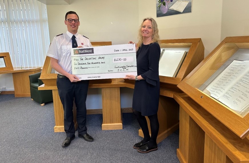 The Salvation Army representative receiving their cheque