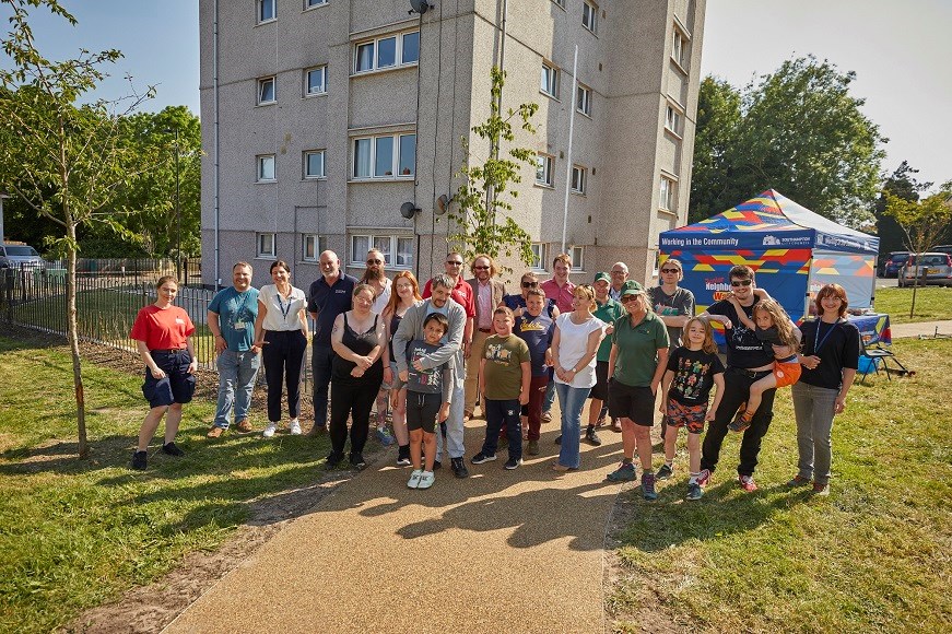 Residents gathered outside a block of flats