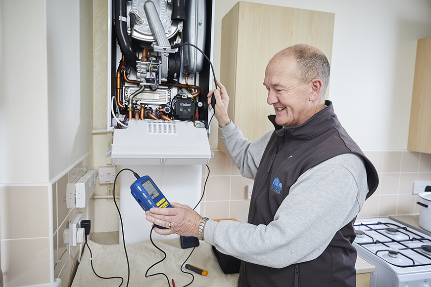 Someone Servicing A Boiler