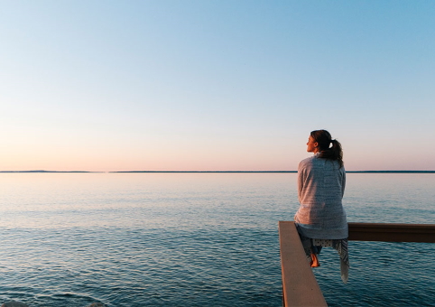 Someone looking out to sea