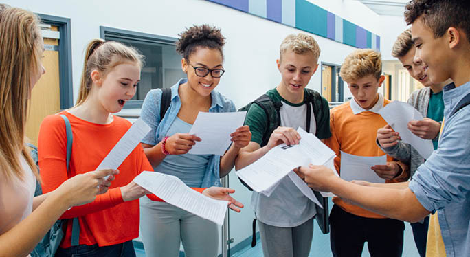 Students excitedly viewing their results