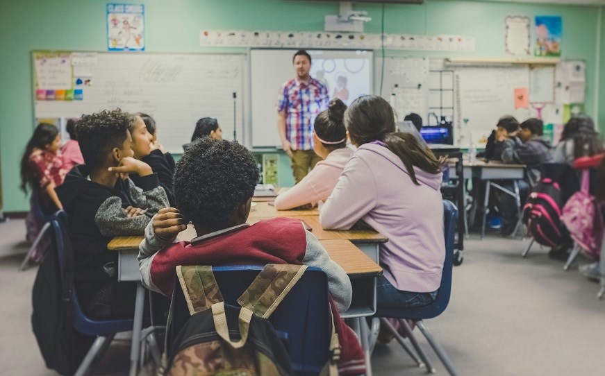 Classroom of pupils looking at teacher