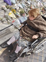 Meg laying flowers at The Civic Centre