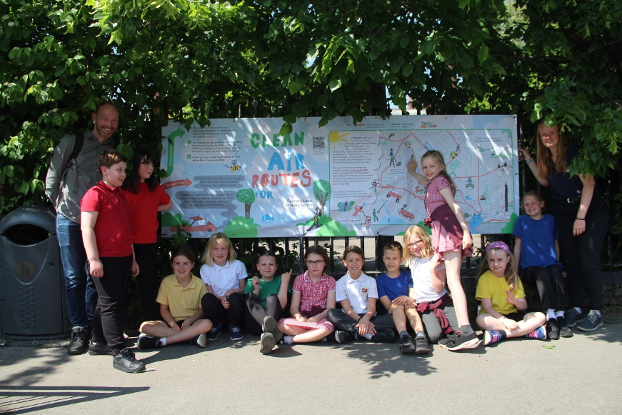 School children in front of Clear Air banner