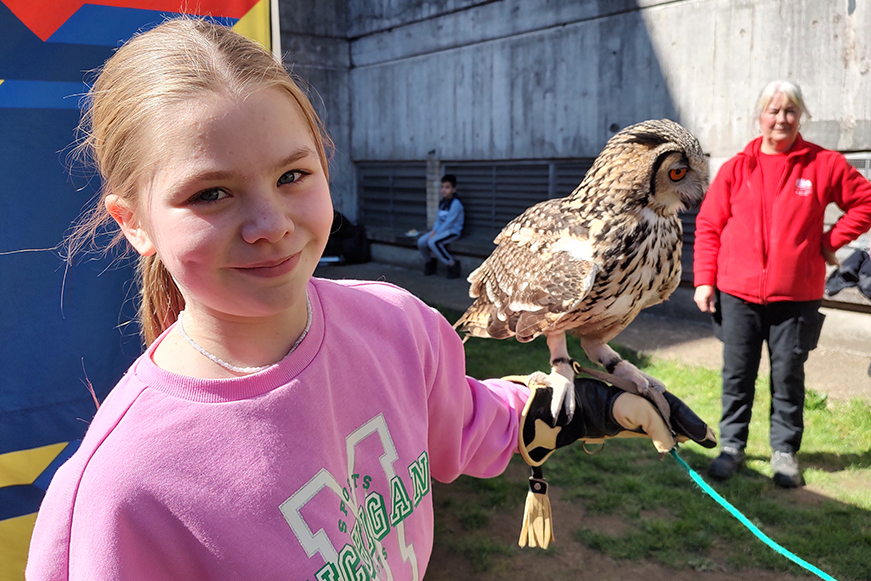 Child With An Owl On Their Arm