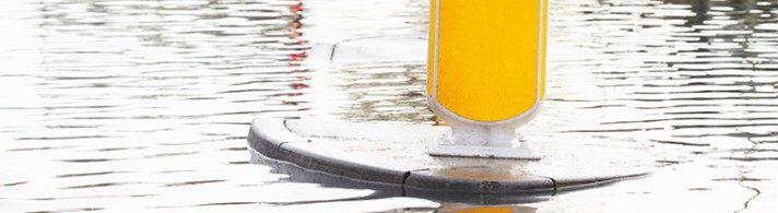 Traffic island surrounded by water