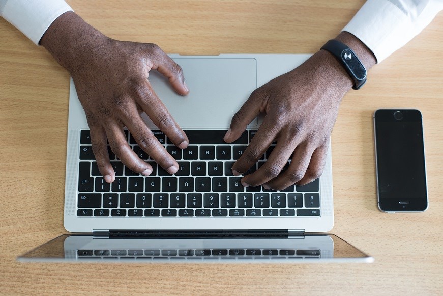 Hands on laptop keyboard