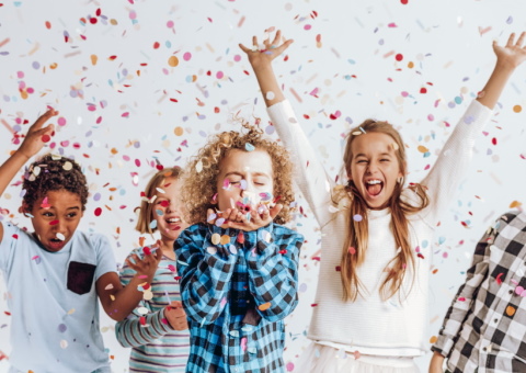 Children celebrating in a shower of confetti