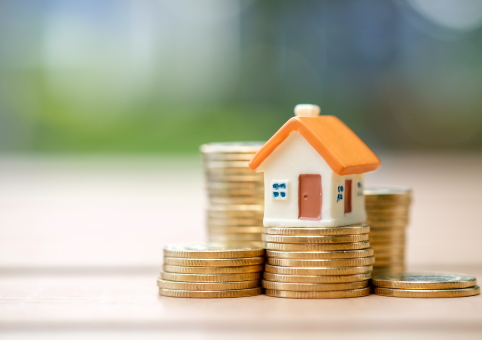 Model house on top of money