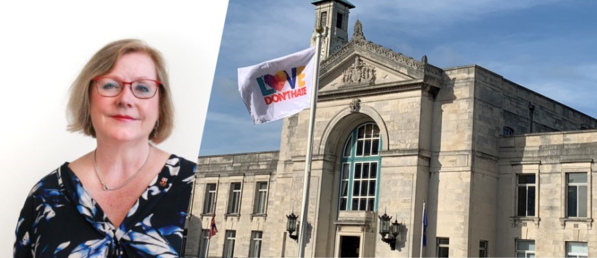 Leader next to photo of Civic Centre